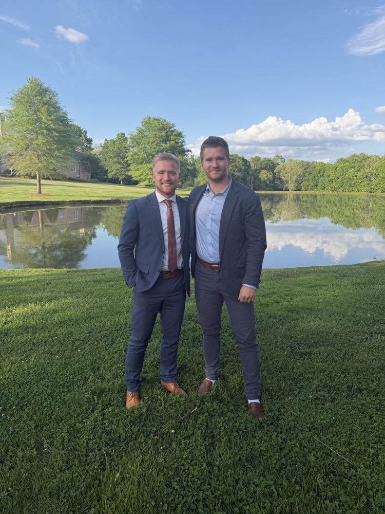 Caleb and Josiah Sherrill, founders of Pillar, standing by a pond in Charlotte